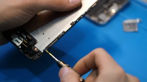 Close view person removes protective frame from display Stock Footage 104655330
