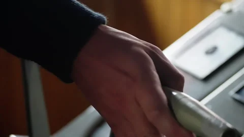 A close-up view of a person s hand gripping a metallic control lever, focusing Video stock 312208585