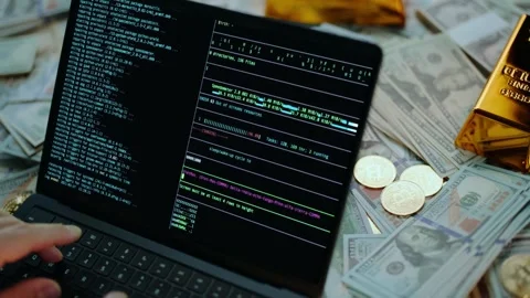 A close-up view of a person typing on a laptop with cryptocurrency data and.. Stock Footage 337472134
