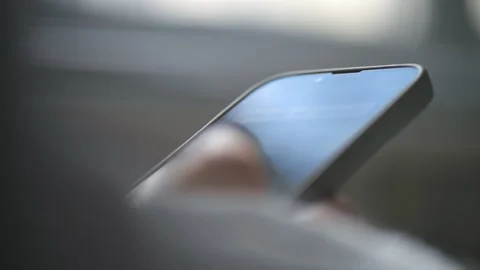 Close view of a person using his smartphone. Slow motion Stock Footage 235282811