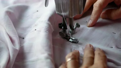 Close-up view of the person working on a sewing machine Видео 167444730