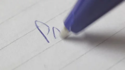 Close up view from a person writing some words in portuguese in a piece of paper Stock Footage 209713331