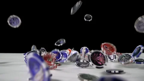 Close-up view in perspective: Pocker chips falling down on the white table Stock Footage 121891432