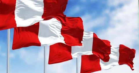 Close-up view of Peru national flags waving in the wind Illustrazione stock
