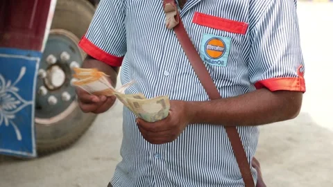 Close view of petrol pump worker counting money Stock Footage 147677264