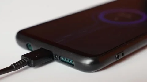 A close view of a phone charging on a cable. Stock Footage 306288625