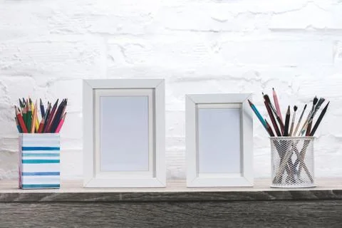 Close up view of photo frames and office supplies at workplace Stock Photos