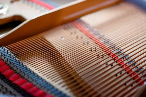 Close-up view of piano strings and hammers inside grand piano Stock Photos
