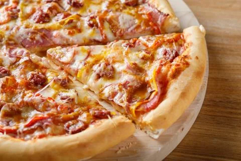 Close-up view of piece of pizza Stock Photos