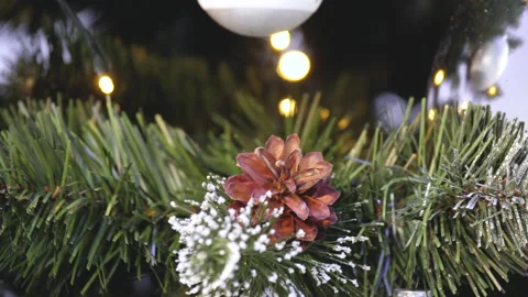 Close Up View Of A Pine Cone In Christmas Tree With Bokeh Lights. Stock Footage 219381210