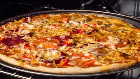 Close-up view of pizza baking inside oven Stock Footage 325490293