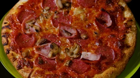 Close up view of pizza being cut with kitchen scissors. Food and drinks concept. Stock Footage 120949146