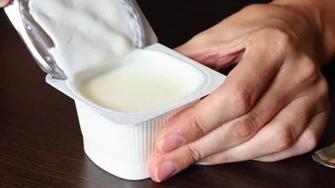 Close up view of plain greek yogurt in a plastic cup. Stock Footage 310626671