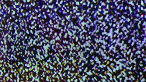 Close up view at a plasma tv while showing white noise . Stock Footage 155557602