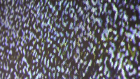 Close up view at a plasma tv while showing television white noise. Stock Footage 205204460