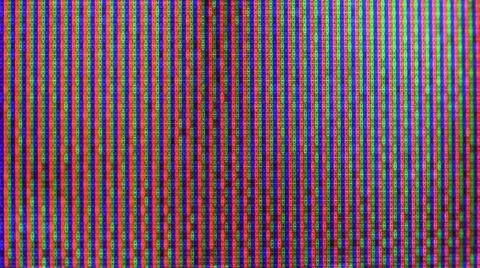 Close up view at a plasma tv while showing television activity. Stock Photos