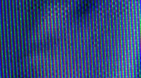 Close up view at a plasma tv while showing television activity. Stock Photos