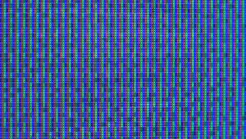 Close up view at a plasma tv while showing television activity. Stock Photos