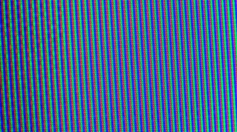 Close up view at a plasma tv while showing television activity. Stock Photos