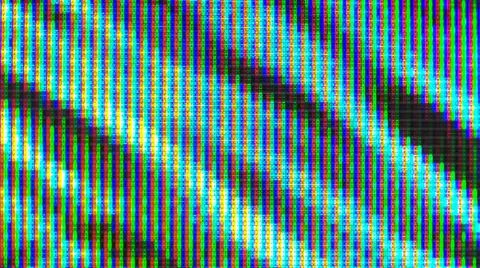 Close up view at a plasma tv while showing television activity. Stock Photos