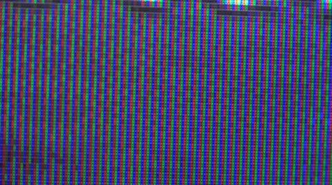 Close up view at a plasma tv while showing television activity. Stock Photos
