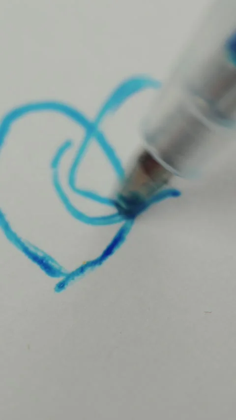 Close up view of plastic ballpoint pen creating bright blue ink scribbles and Stock Footage 347272110
