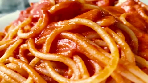 Close-up view of a plate of spaghetti with tomato sauce Stock Footage 140505516