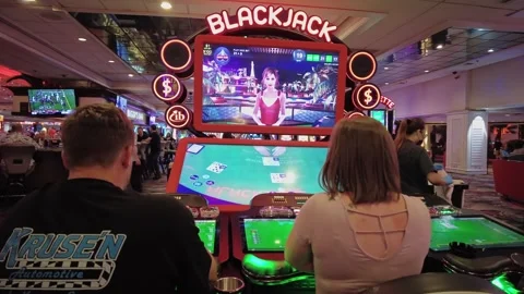 Close up view of players playing electronic blackjack table in Caesars Palace Video stock 328232839