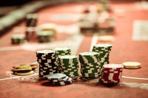 Close up view of poker chips on table in casino Stock Photos