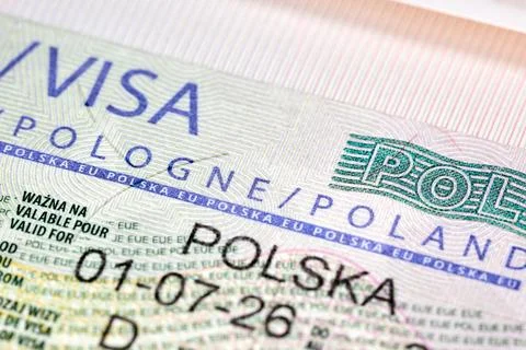 Close-up view of Polish Schengen visa sticker in passport. Document features Stock Photos
