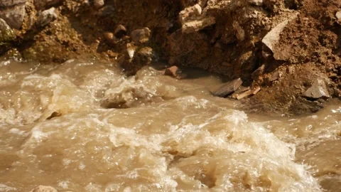 Close view of polluted water flowing, Footage of water pollution Stock Footage 148536479