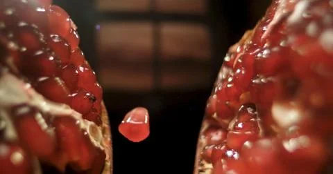 A close-up view of a pomegranate split open Stock Photos