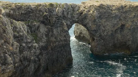 Close view of Pont d'en Gil, natural rock bridge in Minorca, Balearic Islands Stock Footage 303752640