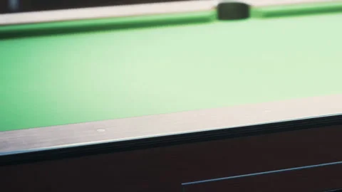 Close view of a pool table with green felt and a wooden frame Stock Footage 345062186