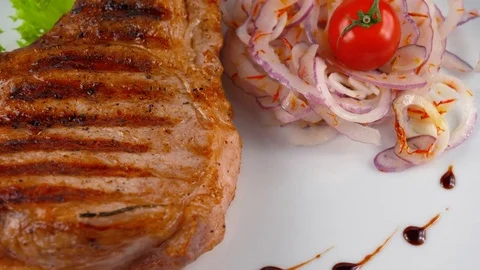 Close-up view of pork chop, Pub or Restaurant food Stock Footage 79713298