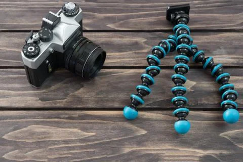 Close up view of a portable three-legged frame  and vintage camera Stock Photos