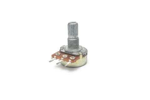 Close-up view of a potentiometer or variable resistor on a white background. Stock Photos