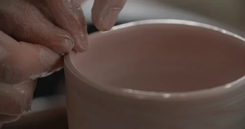 Close up view: potter sculpts a ceramic jug on a potter's wheel, the potter Stock Footage 150806413