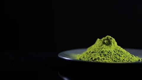Close-up view powdered matcha tea on black Stock Footage 124314697