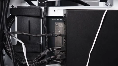Close-up view of power supply unit and cable connections inside white PC ca.. Stock Footage 305673212