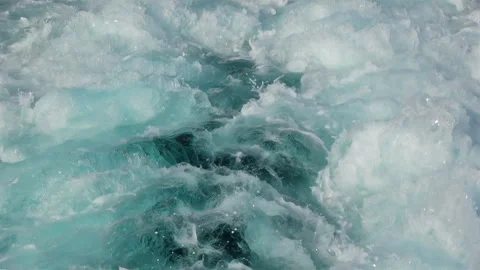 A close-up view of a powerful clear foaming waves and splashes in slow-mo Stock Footage 246426587
