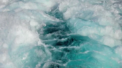 A close-up view of a powerful clear foaming waves and splashes in slow-mo Stock Footage 246426642