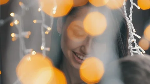 Close up view of a pretty mom with son through bokeh light Stock Footage 121620406