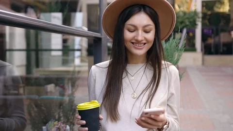 Close view of pretty smiling 30-aged woman with long hair in trendy hat which Stock Footage 120187976