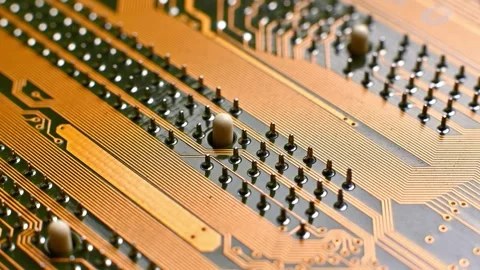 Close-up view of a printed circuit board showing intricate copper traces and Stock Footage 330486111