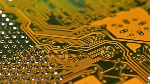 Close-up view of a printed circuit board showing intricate copper traces and Stock Footage 330486288
