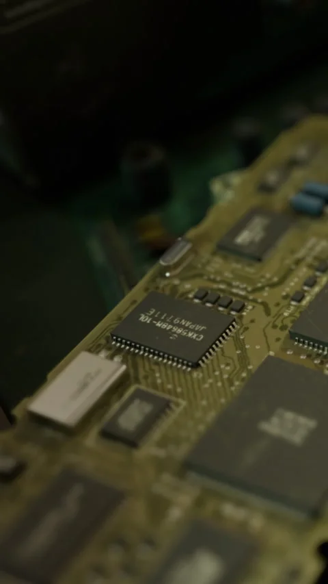 Close view of a printed circuit board with various chips and components Stock Footage 334198497