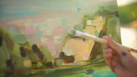 Close up view of process of painting oil picture. Female hand Stock Footage 76748004