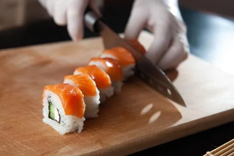 Close-up view of process of preparing rolling sushi. making the sushi with sauce Stock Photos