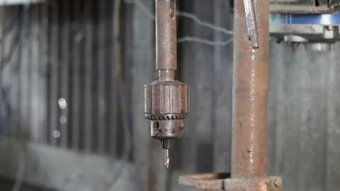 Close-up view of the process of spinning metal spiral drill bit at Video stock 112254246